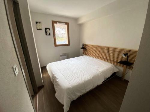 מיטה או מיטות בחדר ב-Résidence Bois De Marie - 5 Pièces pour 8 Personnes 204