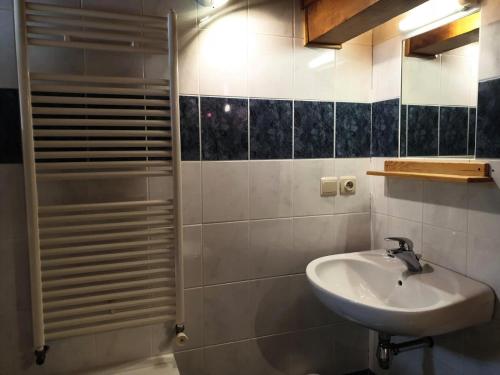 a bathroom with a sink and a shower at Chalet Cosy - Chalets pour 5 Personnes 111 in Morzine