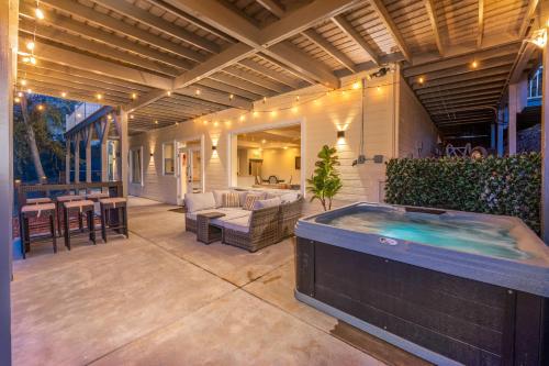a large outdoor hot tub on a patio at TWO homes with Stunning Views King Bed, Level 2 Electric Vehicle Smart Station, Hot Tub, Games and Fire pit, Perfect for Multi-Family Getaways in Coarsegold