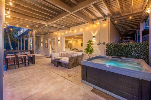 a large outdoor hot tub on a patio at Yosemite Bass Lake VIEWS, 2 Homes, Games, Hot Tub in Coarsegold