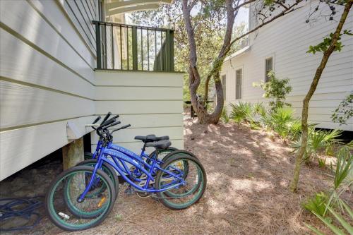 a blue bike parked next to a house at Sans Souci by 30A Escapes in Seacrest