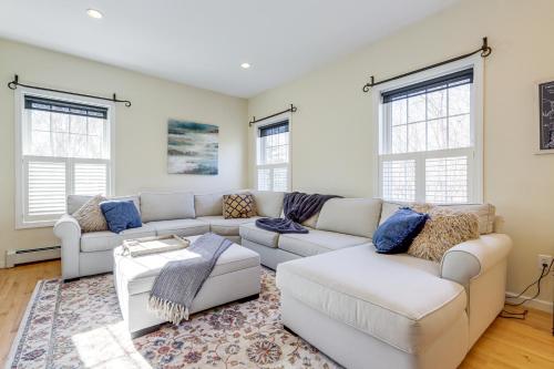 a living room with two couches and a rug at Mystic Retreat with Patio and Grill Walk to River! in Mystic