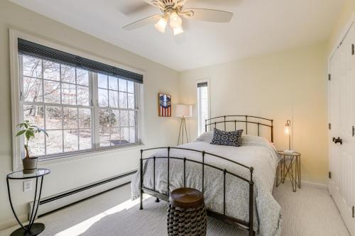 a bedroom with a bed and a window at Mystic Retreat with Patio and Grill Walk to River! in Mystic