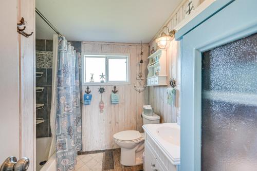 a bathroom with a toilet and a sink and a shower at 1 Mi to Surfside Beach BBQ-Ready Home in Freeport in Freeport
