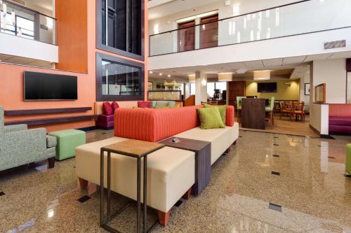 a living room with a couch and a table at Drury Inn & Suites Denver Tech Center in Centennial