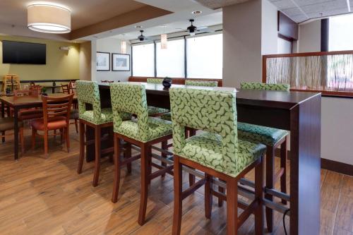 a dining room with a table and chairs at Drury Inn & Suites Denver Tech Center in Centennial