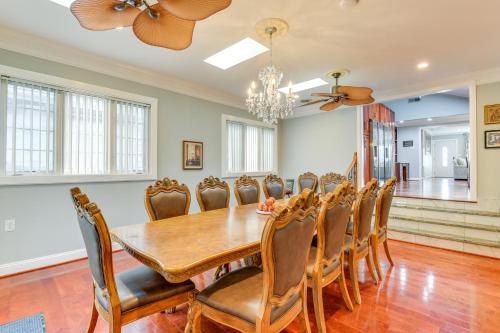 a dining room with a table and chairs at Spacious Home with Tranquil Patio about 29 Mi to DC! in Severn