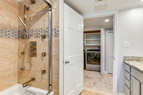 a bathroom with a shower and a sink at Spacious Home with Tranquil Patio about 29 Mi to DC! in Severn