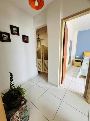 a room with a hallway with a room with a room at apartamento no centro Guarapari com garagem! in Guarapari