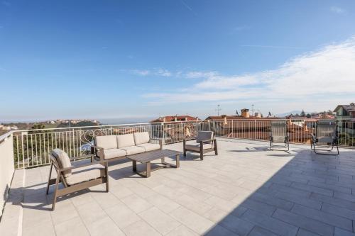 a balcony with chairs and a view of the ocean at Antica Colombaia in San Marino
