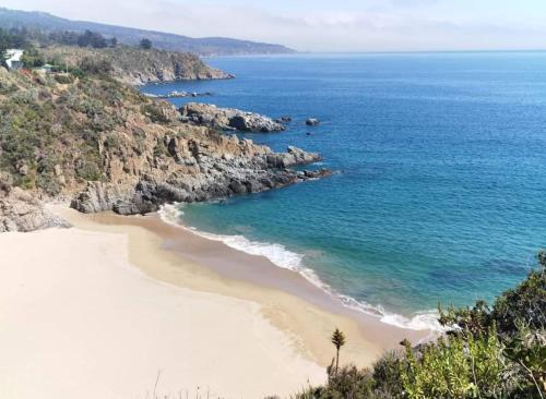 an aerial view of a beach next to the ocean at Casona Pretton in Valparaíso