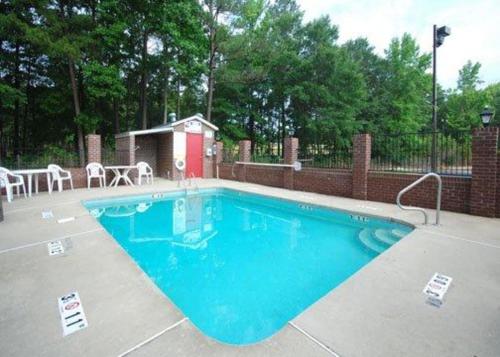 a large swimming pool with a red out house at Quality Inn Kenly I-95 in Kenly