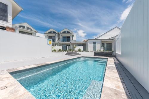 a swimming pool in the backyard of a house at Harrington Marina in Harrington