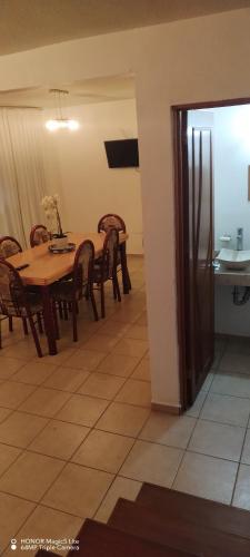 a dining room with a table and chairs at Casa Gerbera Queretaro in Querétaro