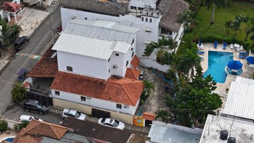 an overhead view of a city with houses and a pool at Casa angelina in Sosúa