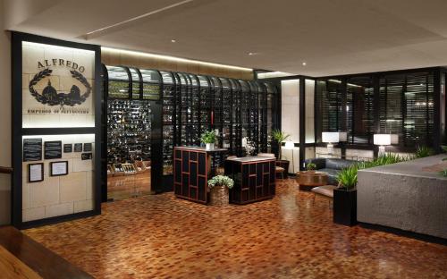 a lobby of a hotel with a wine tasting room at Presidente InterContinental Mexico City by IHG in Mexico City