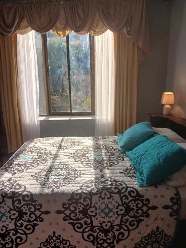 Кровать или кровати в номере Habitaciones el mirador
