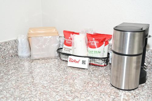 a counter with a trash can and other food items at Red Roof Inn Spartanburg - I-85 in Spartanburg