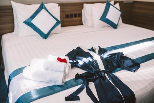 Postel nebo postele na pokoji v ubytování Rum Vang Hotel Da Lat