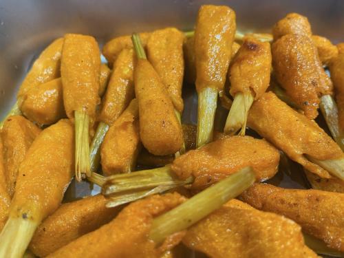 a pile of fried food with asparagus at Hotel Hoa Nắng in Bao Loc