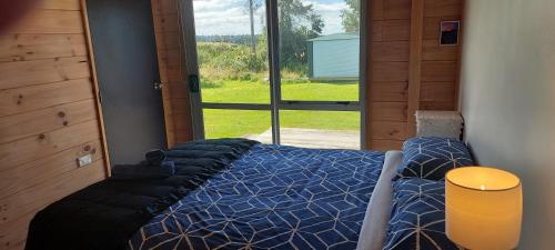 Postel nebo postele na pokoji v ubytování Tongariro Estate