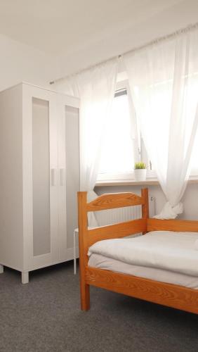 a bedroom with two bunk beds and a window at Dom św. Józefa in Szczecin