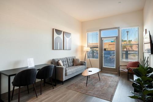 a living room with a couch and a table at Modern CozySuites on the Town Lake waterfront 12 in Tempe