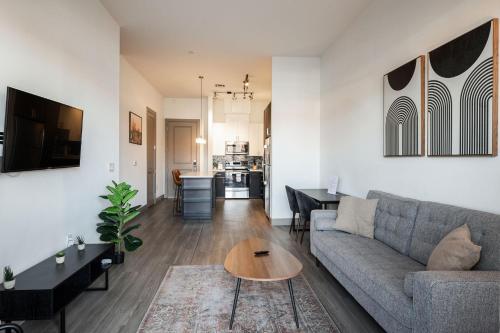 a living room with a couch and a table at Modern CozySuites on the Town Lake waterfront 12 in Tempe