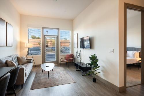 a living room with a couch and a table at Modern CozySuites on the Town Lake waterfront 12 in Tempe