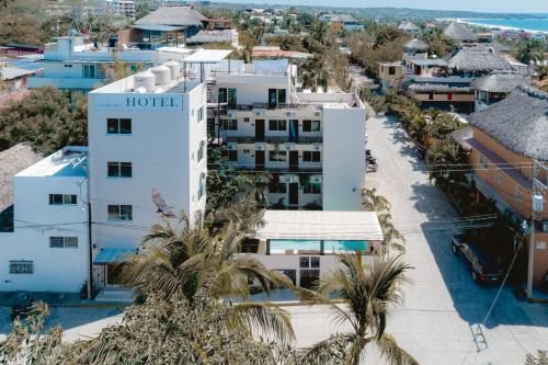 an aerial view of a hotel with palm trees at Guitarra Inn in Puerto Escondido