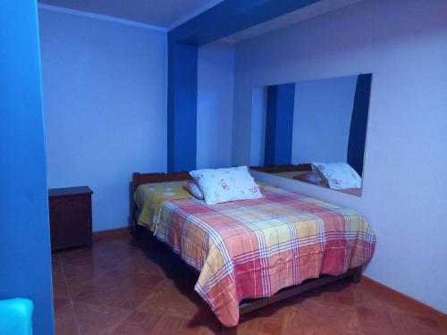 En eller flere senge i et værelse på Hospedaje TOSCANO SUITES