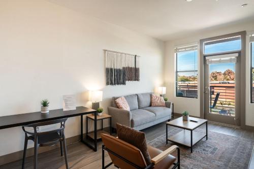 a living room with a couch and a table at Modern CozySuites on the Town Lake waterfront 15 in Tempe