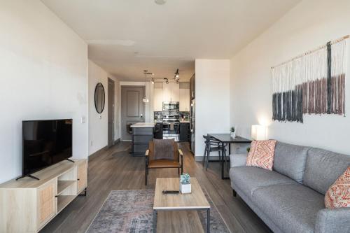 a living room with a couch and a table at Modern CozySuites on the Town Lake waterfront 15 in Tempe