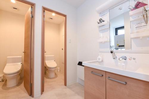 a bathroom with a toilet and a sink at Ryoan / Vacation STAY 80261 in Otaru