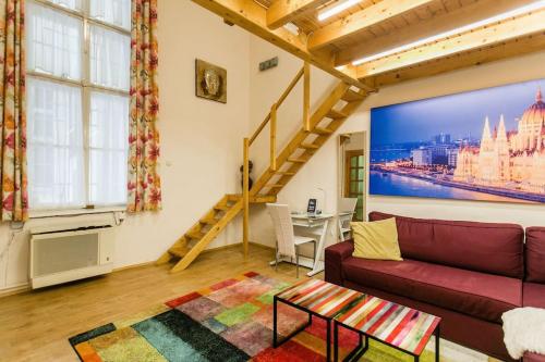 a living room with a couch and a table at Izabella Good Karma Home in Budapest