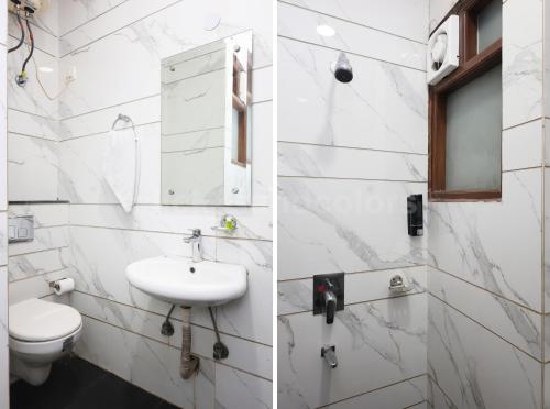 a white bathroom with a sink and a toilet at Hotel Park Residency By BYOB Hotels in New Delhi