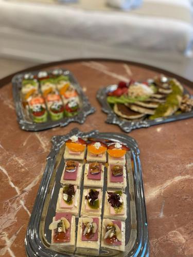 a tray of food on top of a table at DBD Hotel Bayraklı in Bayrakli