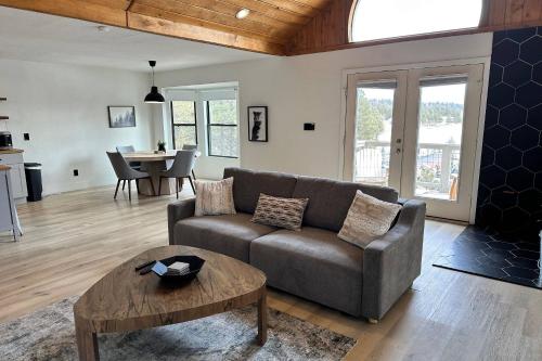 a living room with a couch and a table at 785 Aspenglow Blvd ("Bear's Cliff") in Pagosa Springs