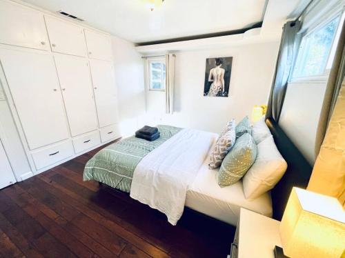 a small bedroom with a bed and a window at 40223 Fremont Entire Coze 3brs house Free Parking nd AC in Fremont