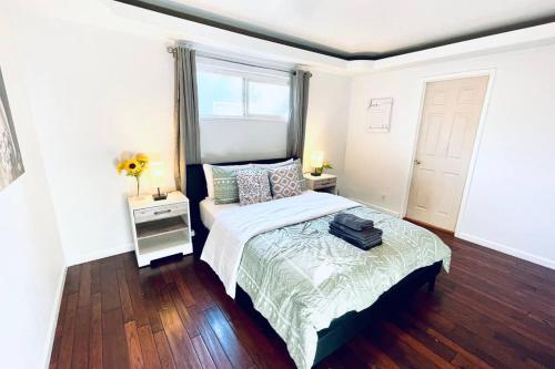 a bedroom with a bed and a window at 40223 Fremont Entire Coze 3brs house Free Parking nd AC in Fremont