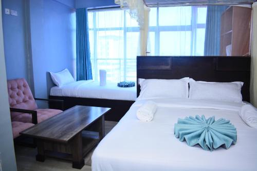 Postel nebo postele na pokoji v ubytování BRIMAK HOTEL