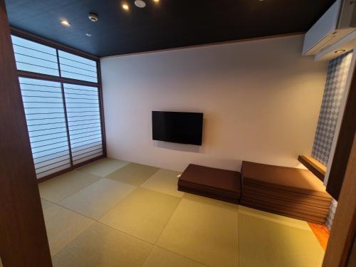 TV a/nebo společenská místnost v ubytování Spa & Hotel Suishun Matsuiyamate