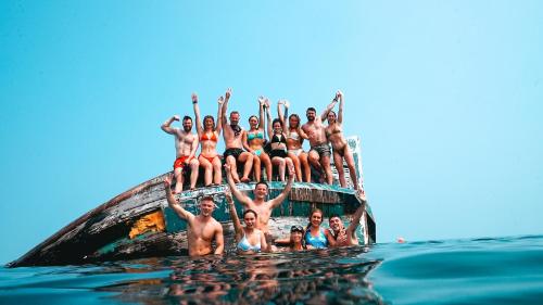 a group of people in the water on a boat at Hudhuvelimaldives in Omadhoo