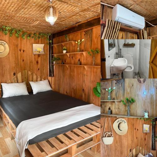 um quarto com uma cama num quarto com paredes de madeira em Mộc Home em Cu Lao Thu