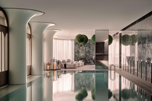 a rendering of a living room with a pool of water at Regent Shanghai on the Bund in Shanghai