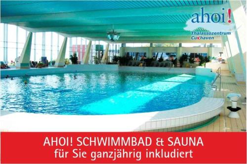 a large swimming pool in a large building at Haus Pavillon, App 20 in Döse