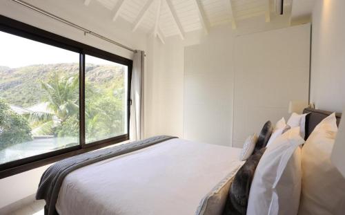 Voodi või voodid majutusasutuse Luxury Vacation Villa 14 toas