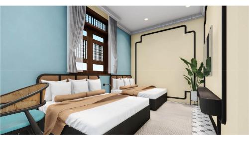 Duas camas num quarto com paredes azuis em Sai Gon 1962 Inn em Cidade de Ho Chi Minh