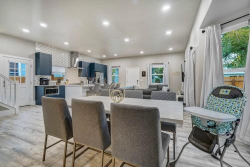 a kitchen and living room with a table and chairs at Baby Blue - Hot Tub Easy Access to Top Locations in Colorado Springs