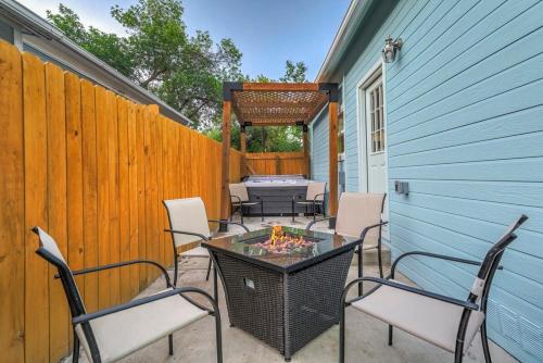 a patio with chairs and a table and a fence at Baby Blue - Hot Tub Easy Access to Top Locations in Colorado Springs